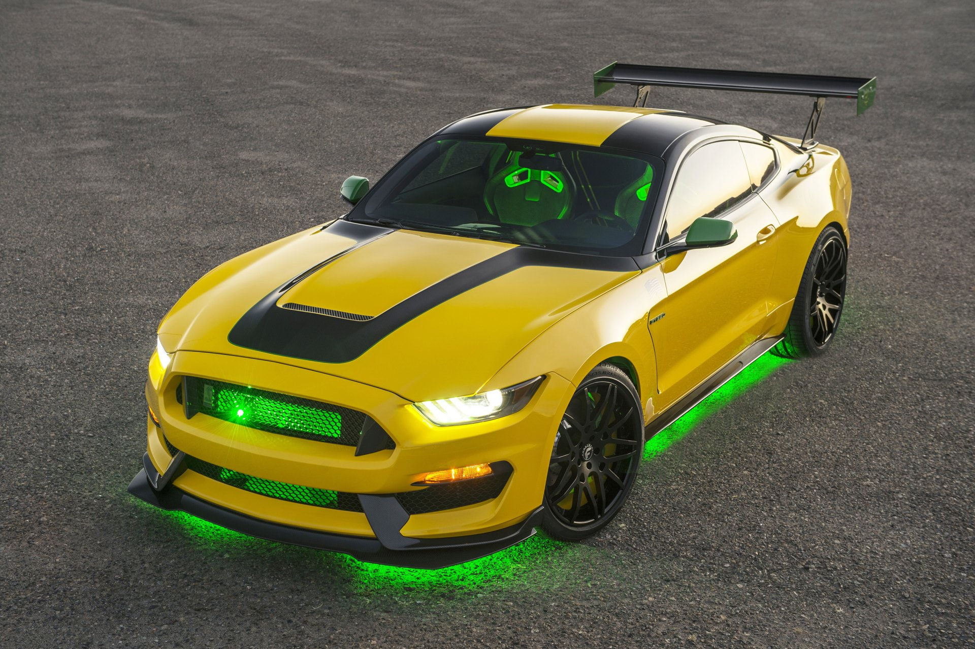 Wallpaper #nUUgl44B7YBJg1BVN6AP45 A Yellow Ford Mustang with Green Underglow Lighting