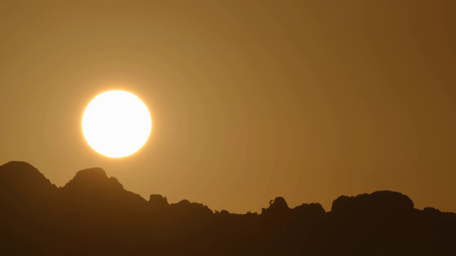 Wallpaper #x--qS5MBMN-XEVvVnztn514 Mountain Terrain Silhouette Against Morning Orange Sky and Big Golden