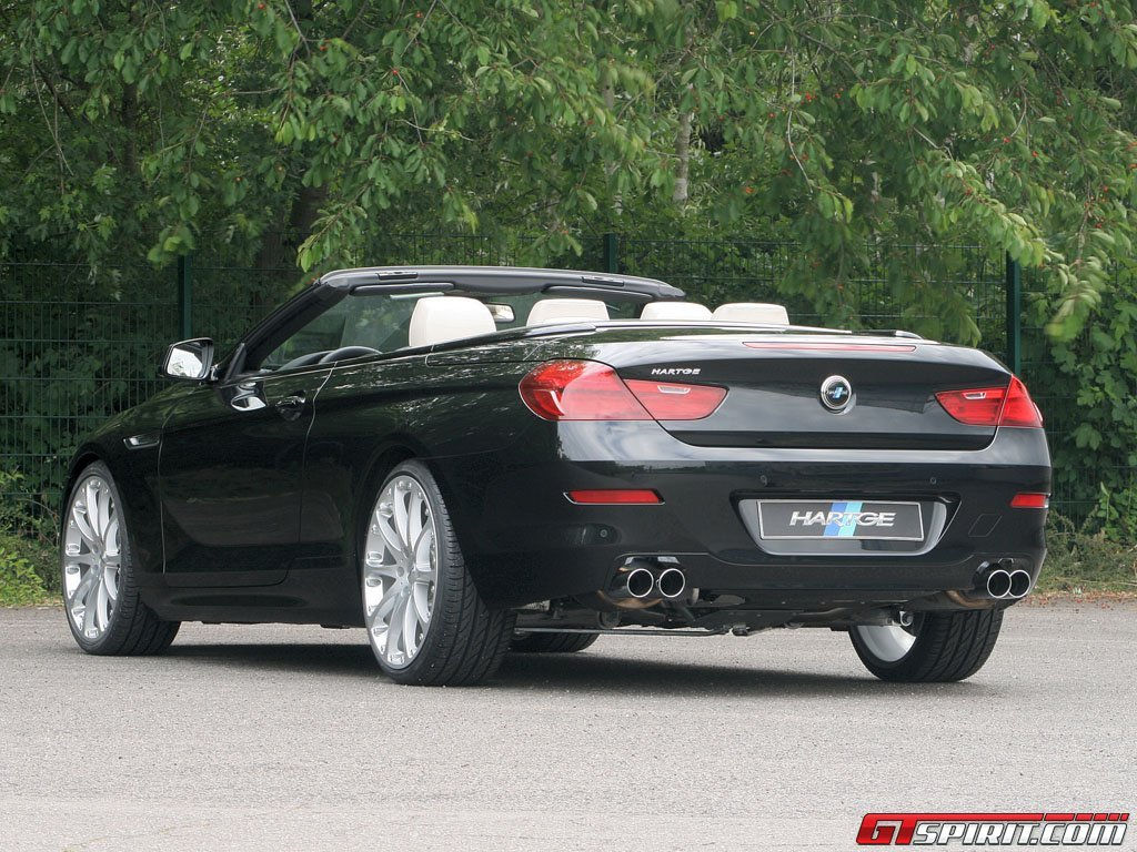 Wallpaper #VkVolo4B7YBJg1BVLqAC35 A Black BMW 6 Series Convertible Parked on a Road with Trees in the Background