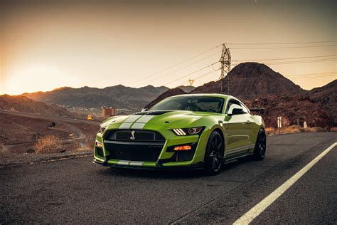 Wallpaper #YnP0fo4BFI5NbQksIxfN62 A Green Ford Mustang Shelby Gt500 on an Open Road
