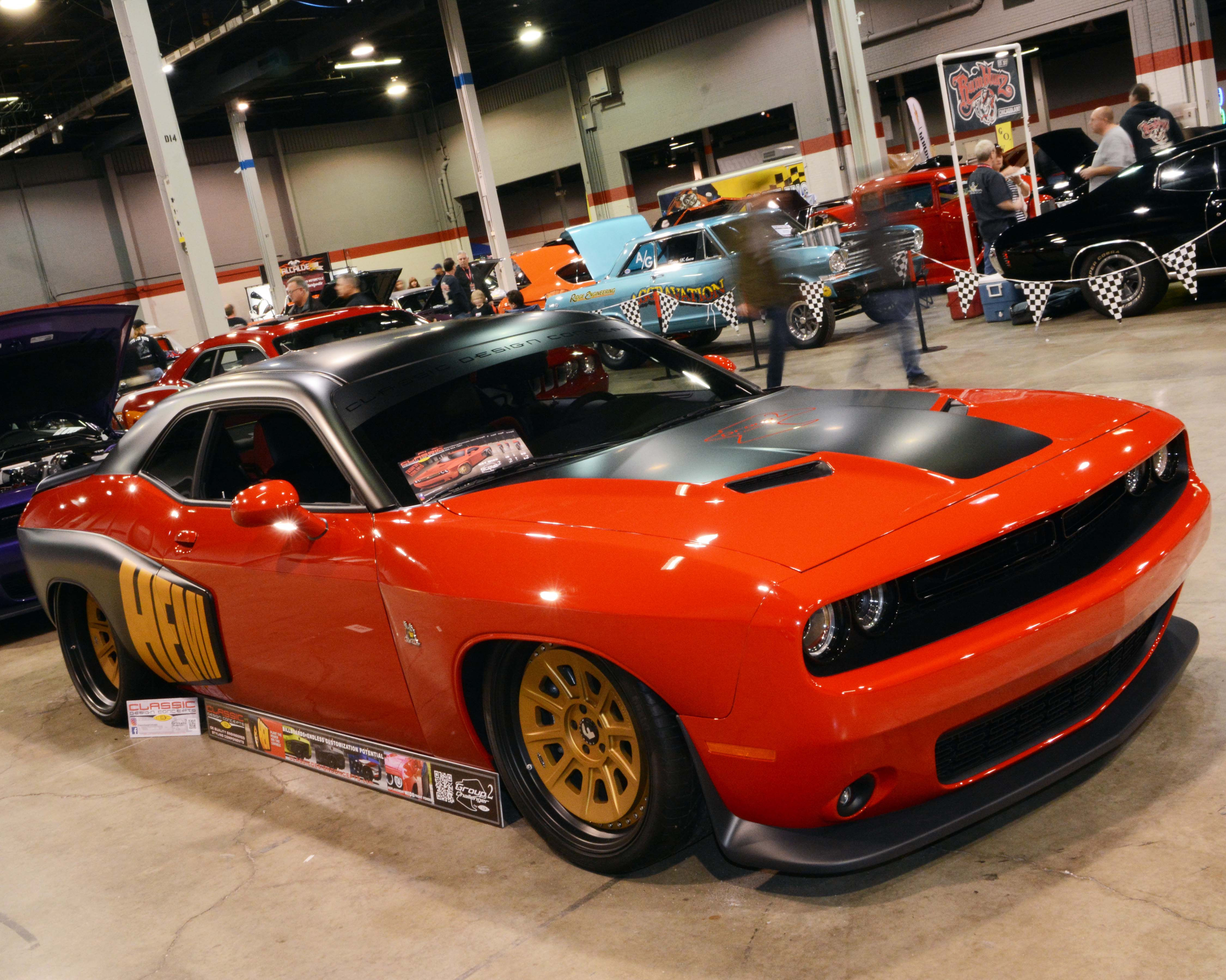 Wallpaper #lnOZg44BFI5NbQks9htG52 A Red and Black Dodge Challenger Srt Hellcat on Display at a Car Show