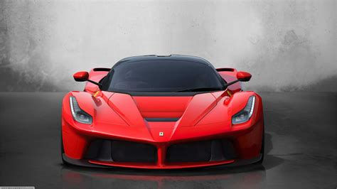 Wallpaper #YnP0fo4BFI5NbQksIxfN57 A Sleek Red Sports Car with a Powerful Engine
