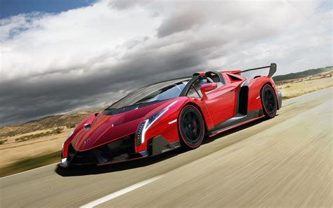 Wallpaper #YnP0fo4BFI5NbQksIxfN33 A Red Lamborghini Veneno Roadster Speeds Along a Coastal Highway